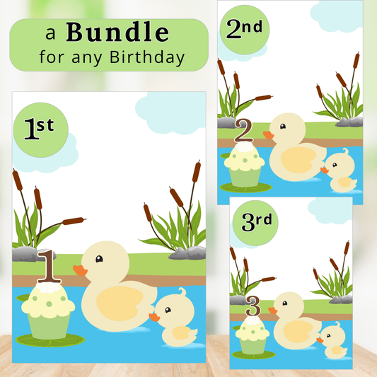Three birthday cards with ducks and numbers on a wooden surface