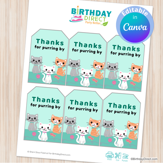 Sheet of 'Thanks for purring by' cat-themed gift tags from Birthday Direct on a wooden surface.