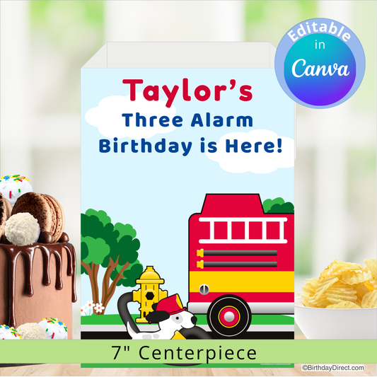 Fire truck-themed birthday centerpiece with text 'Taylor's Three Alarm Birthday is Here!' on a blurred background of cake and snacks.