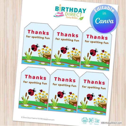 Sheet of 'Thanks for spotting fun' stickers with ladybug design on a wooden surface