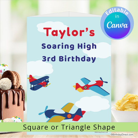 Birthday centerpiece decoration with airplanes and cake, featuring 'Taylor's Soaring High 3rd Birthday' text.