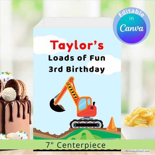 Birthday party centerpiece with excavator design and text 'Taylor's Loads of Fun 3rd Birthday' on a blurred background.