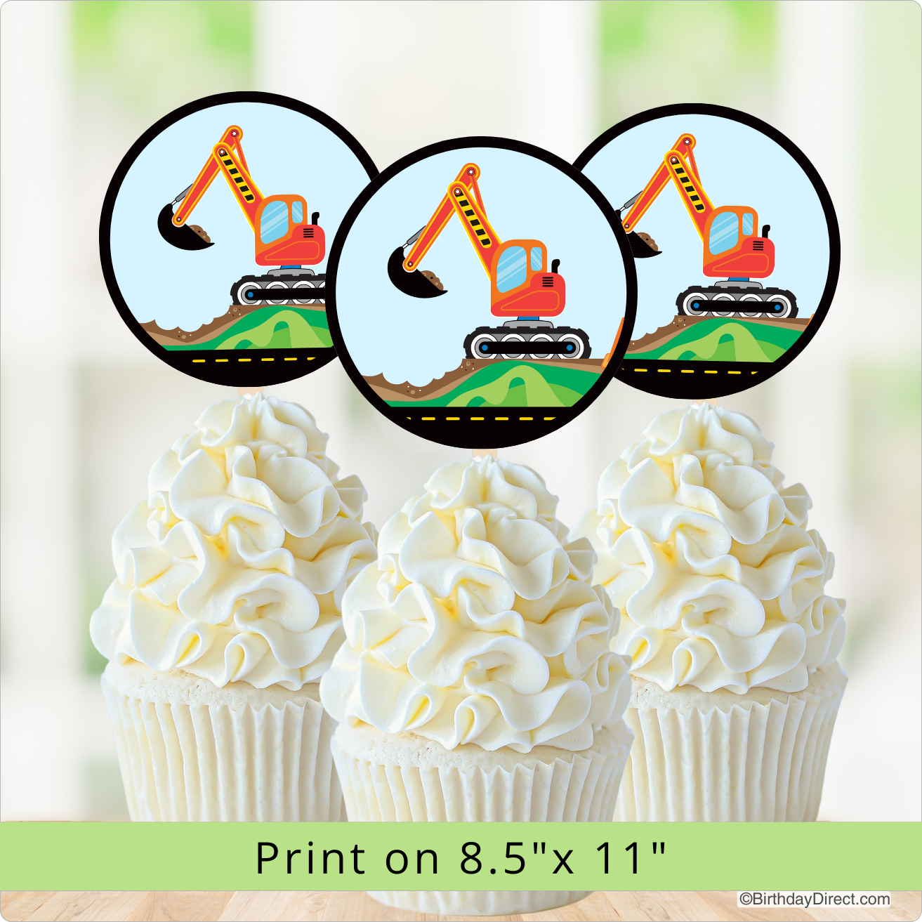 Cupcakes with white frosting and construction-themed cupcake toppers on a blurred background.