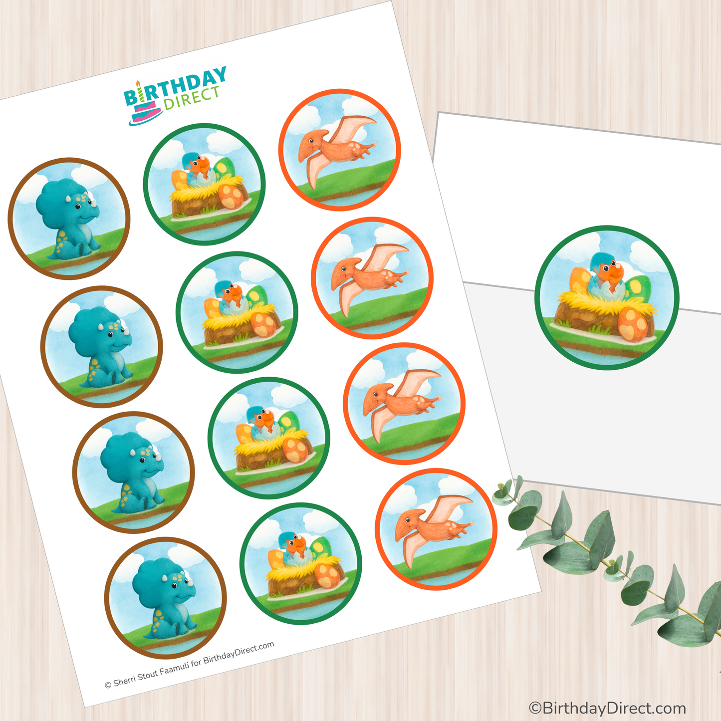 Sheet of dinosaur-themed circles with 'Birthday Direct' branding on a wooden surface.