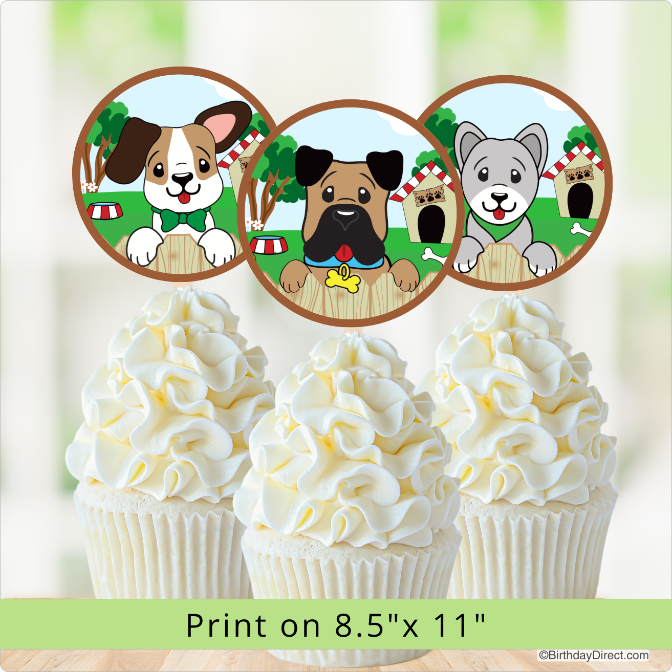 Three cartoon dog illustrations on cupcake toppers with a blurred background.