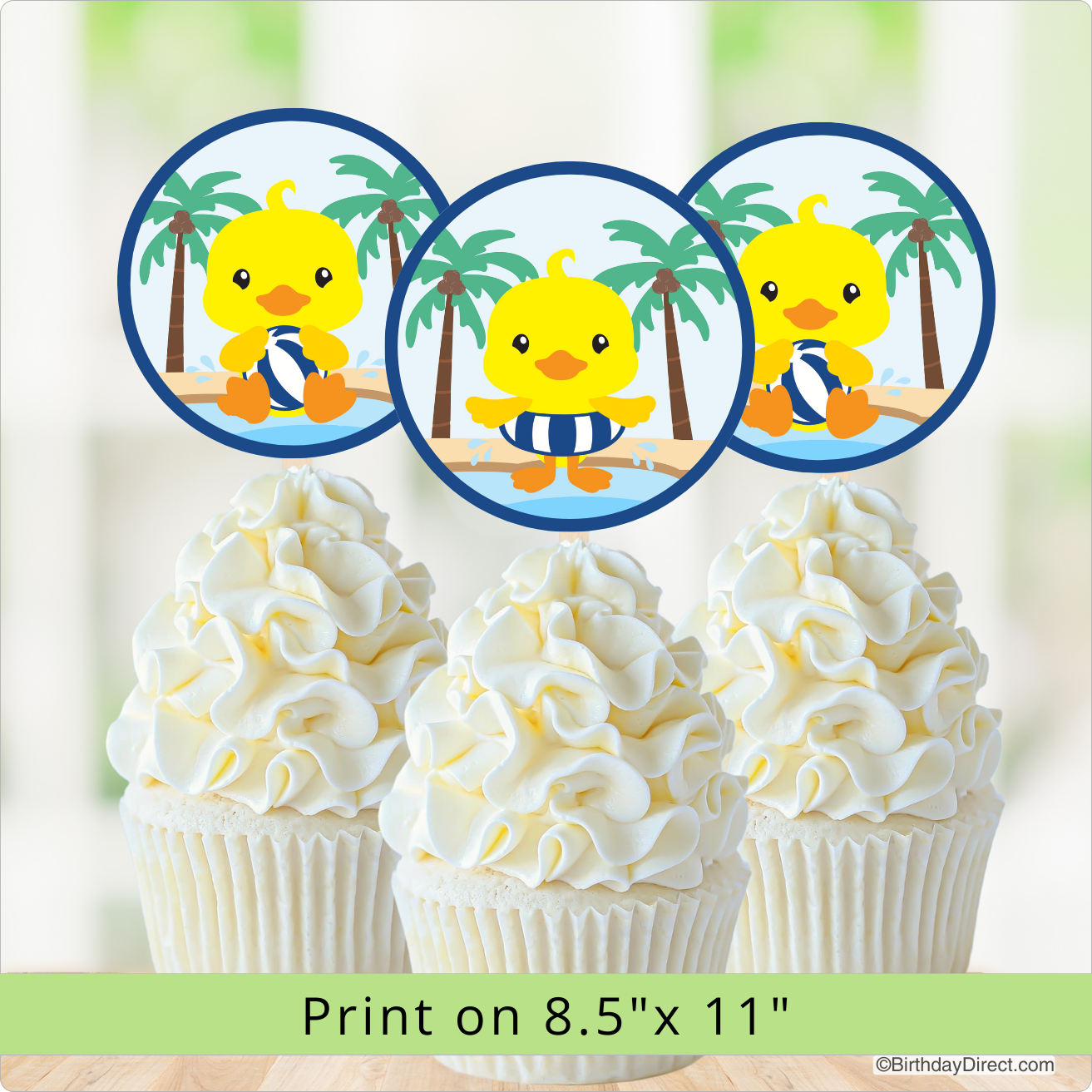Cupcakes with yellow duckling decorations on a blurred background