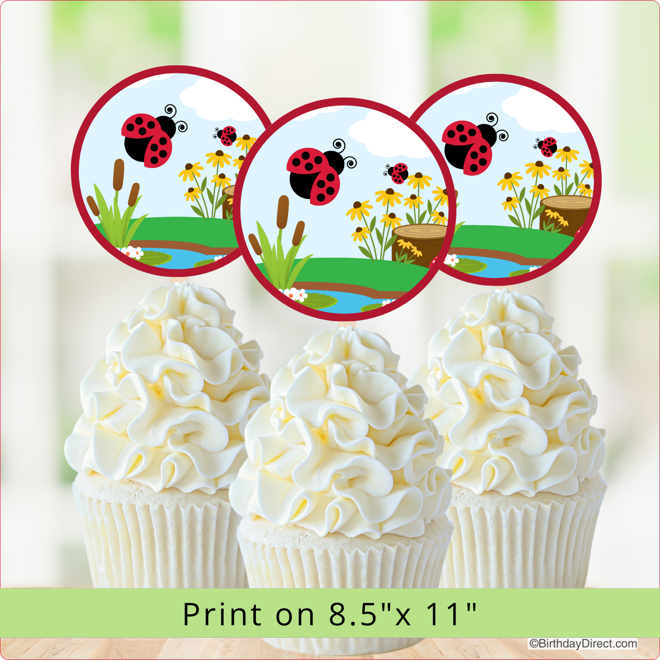 Cupcakes with white frosting and ladybug-themed toppers on a light background