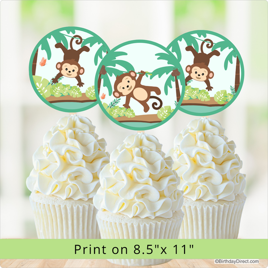 Cupcakes with monkey-themed toppers on a light background