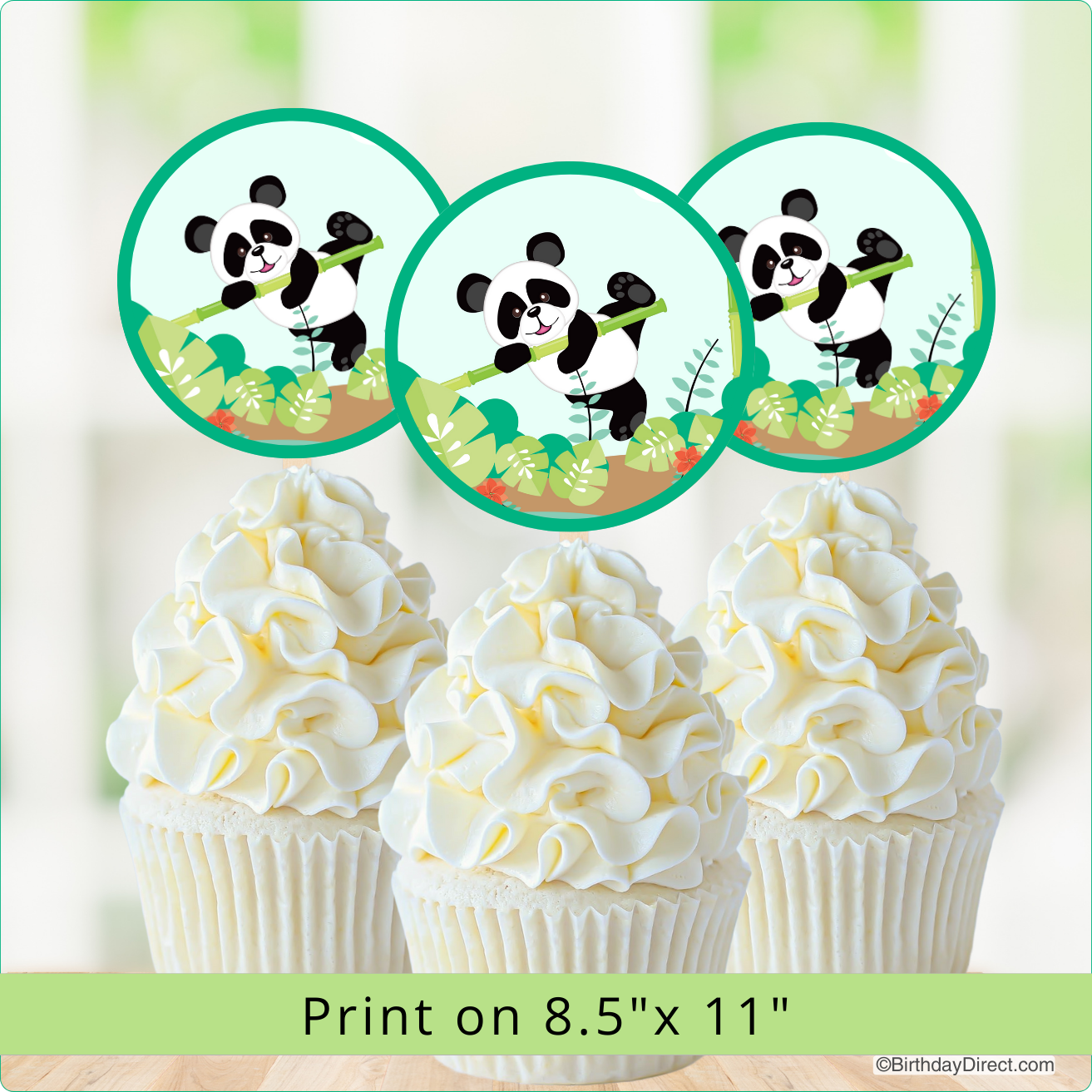 Panda-themed cupcake toppers with white frosting on cupcakes against a light green background.