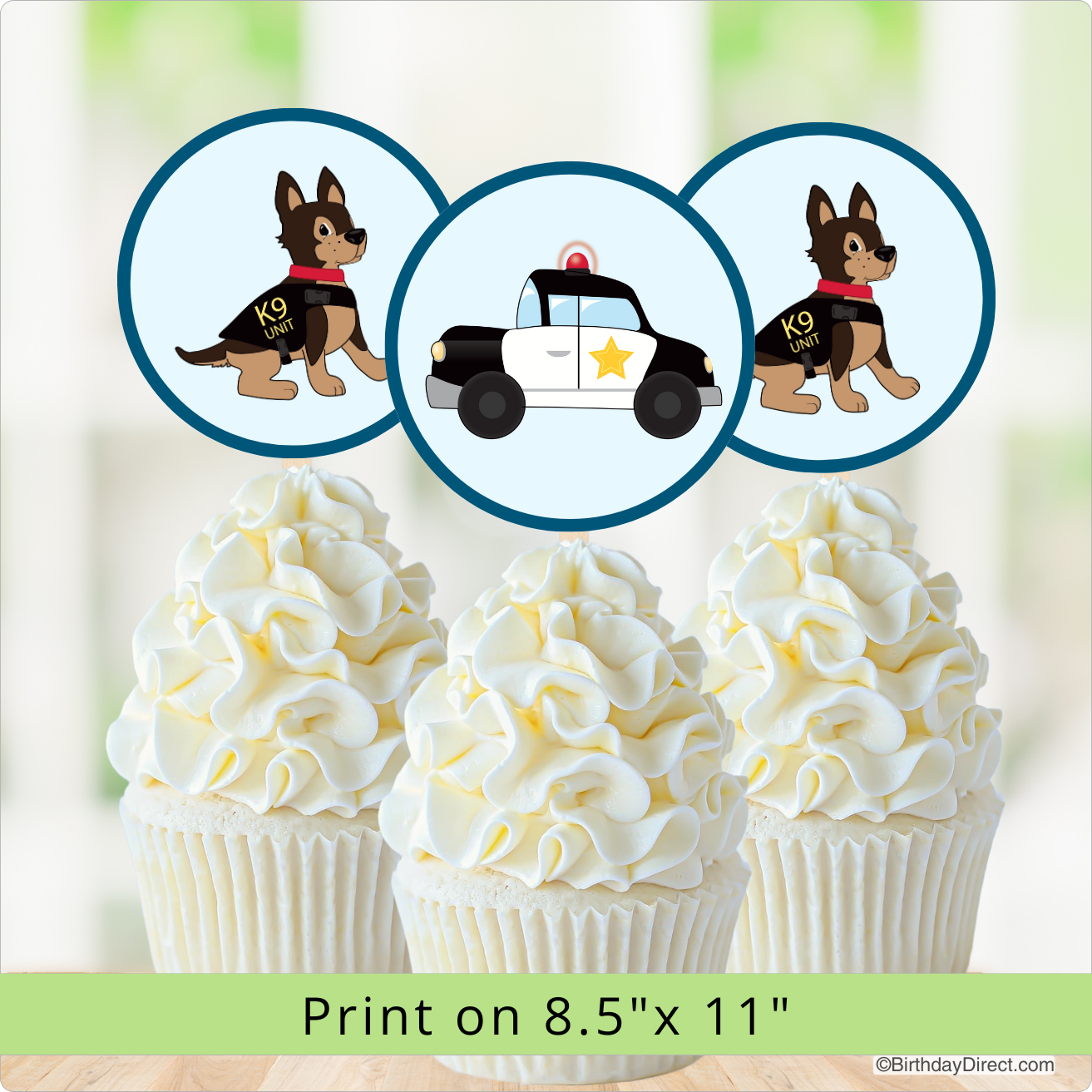 Cupcakes with white frosting and a police-themed design featuring a dog and a police car on a light green background.