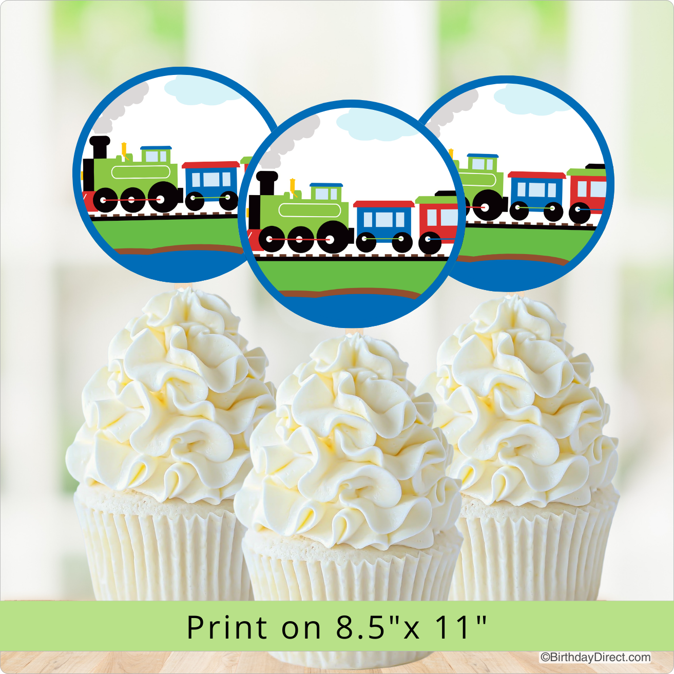 Cupcakes with white frosting and a train design in the background